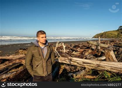 Lone man at beach, autumn. USA Pacific coast landscape, Cape Disappointment, Washington State