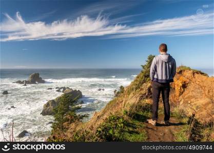 Lone man at USA Pacific coast landscape, Oregon State