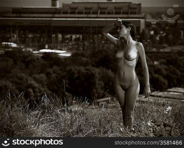 loneliness in the city. urban scene with naked girl