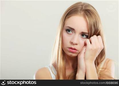 Loneliness negative emotion concept. Young sad stressed woman closeup