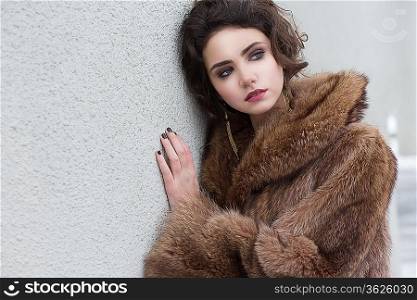 Loneliness. Winter. Beautiful Refined Female in Wool Fur Coat