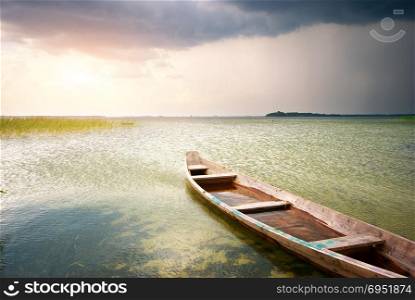 Lonely boat on lake. Composition of nature.