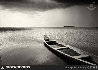 Lonely boat on lake. Composition of nature.. Lonely boat on lake