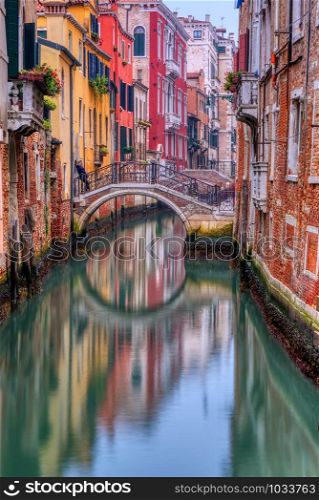 Lonely canal in Venice at sunrise, Italy