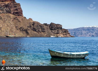 Lonely fishing boat at coastline of Aegean sea, Greece
