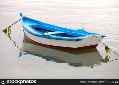 Lonely fishing boat on a calm sea