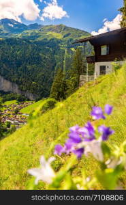 Lonely house near mountain village Lauterbrunnen, Bernese Oberland, Switzerland.. Mountain village Lauterbrunnen, Switzerland