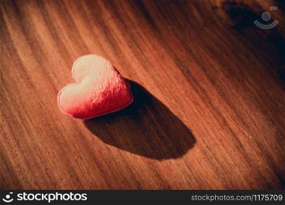 Lonely sad heartbroken Disappointed love Valentines day concept / Hearts on a wooden background