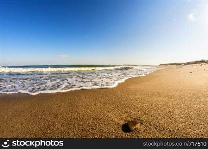 lonesome beach of the Baltic Sea with pebble and surf