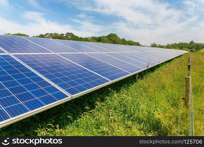 Long diagonal row of blue solar panels in Holland