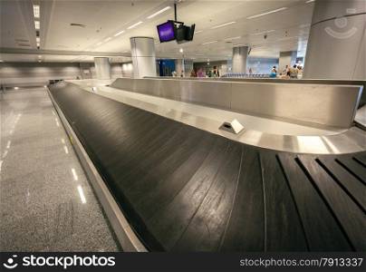 Long empty luggage claim line in airport