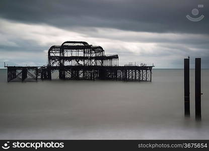 Long exposure blurred sea derelict pier