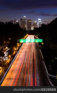 Long exposure brake lights trail on into downtown Los Angeles California