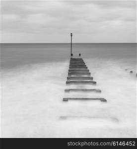 Long exposure landscape image of sea and groynes