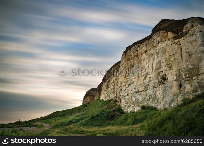 Long exposure landscape of blur sky over vibrant cliffs