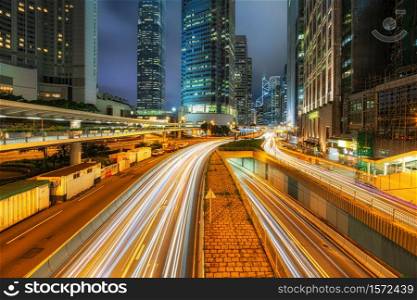 Long exposure of Hong Kong Cityscape skyscaper which have light traffic transportation from car or bus on Central Business District around IFC building, Hong Kong