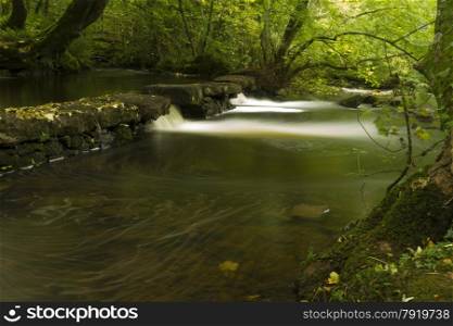 Long exposure of small waterfalls, The Dingle (Nant y Pandy) Llangefni, Anglesey, Wales, United Kingdom.