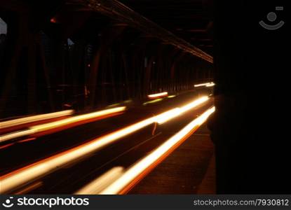 Long exposure of traffic over a bridge at night.