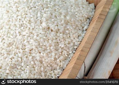 Long grain white rice in wooden bowl