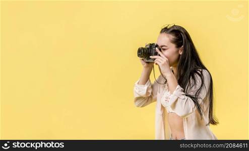 long haired woman holding camera taking picture