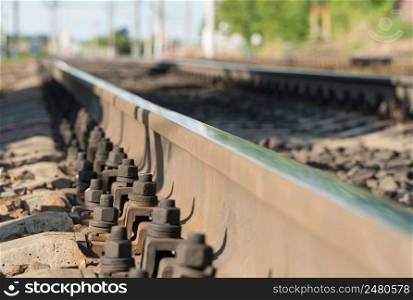 long railroad tracks with blurry background, close-up. long railway line