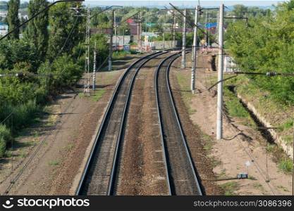long railroad tracks with landscape, top view. long railway line