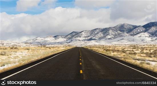 Long set of snowcovered foothills and ridges along highway 50 in Nevada