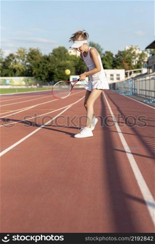 long shot girl playing tennis