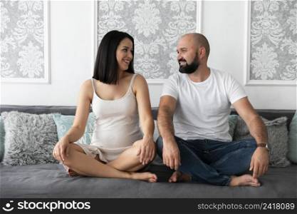 long shot happy couple expecting their baby