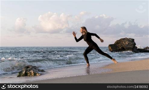 long shot woman running beach