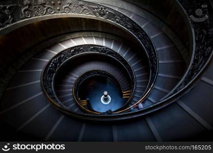 Long spiral, winding stairs. Dark shadows, mysterious mood with single soft light.. Long spiral, winding stairs. Dark shadows, soft light.