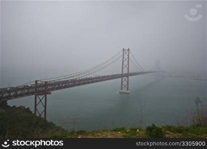 long suspension bridge connecting Lisbon with its suburbs on the other side of the Tejo