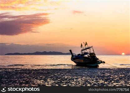 Long tail boat at sunset, Pak Meng beach, Trang, Thailand