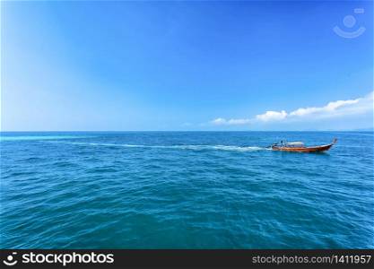 Long Tail boat on island clear sea and blue sky