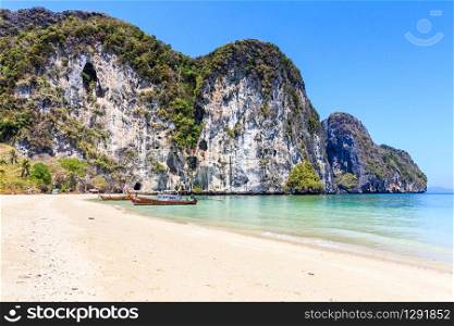 Long tail boat on white sand beach on the island of Koh Lao Liang, ThailandKoh Lao Liang, Thailand