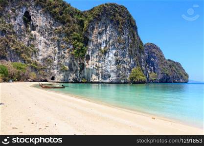 Long tail boat on white sand beach on the island of Koh Lao Liang, ThailandKoh Lao Liang, Thailand