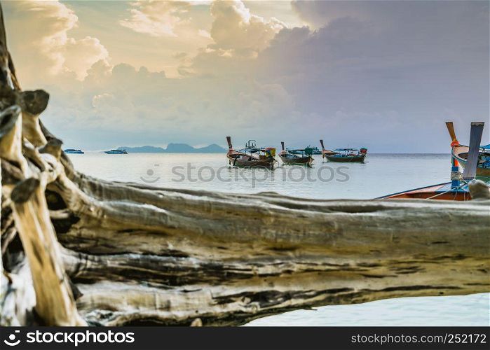 long tailed boat, fishing boat, motor boat on the sunrise scene