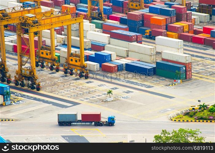 Long vehicle truck loaded with containers at Singapore industrial port