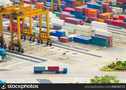 Long vehicle truck loaded with containers at Singapore industrial port