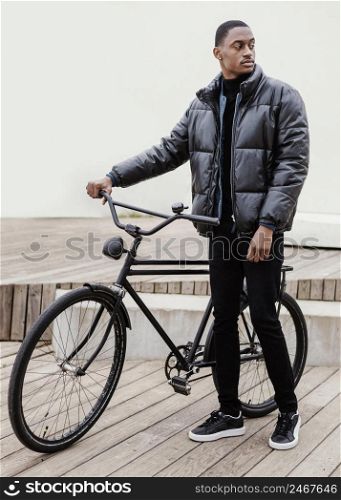 long view man with his bicycle