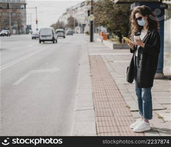 long view woman waiting bus station