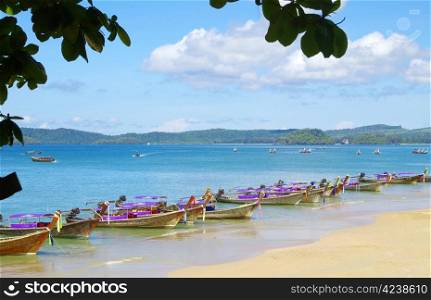longtail boats on a tropical sea
