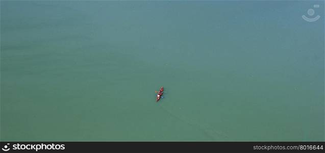 Look down on to the canoe in calm lake