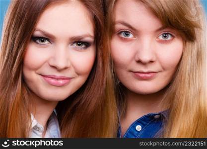 Look results of using cosmetics. Portrait of two girls one with and second without make up. Comparison of natural and cosmetical beauty of women.. Comparison of girls with and without make up.