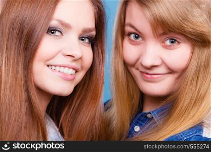 Look results of using cosmetics. Portrait of two girls one with and second without make up. Comparison of natural and cosmetical beauty of women.. Comparison of girls with and without make up.