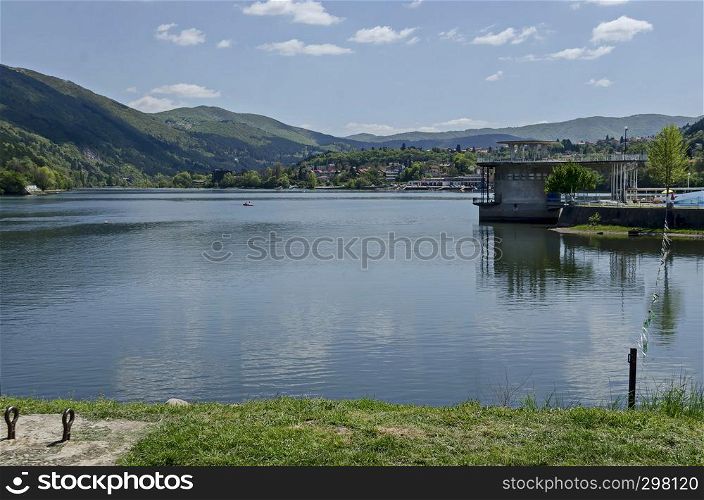 Look toward environment of springtime picturesque dam with mineral baths, resort village Pancharevo in Plana mountain and waterside of Lozen mountain, Sofia, Bulgaria
