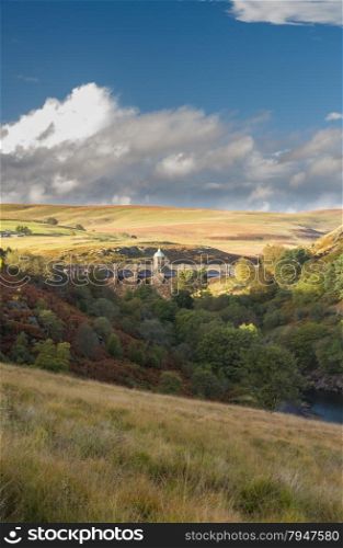 Looking across valley to the Craig Goch dam and reservoir. Autumn fall tree colours.