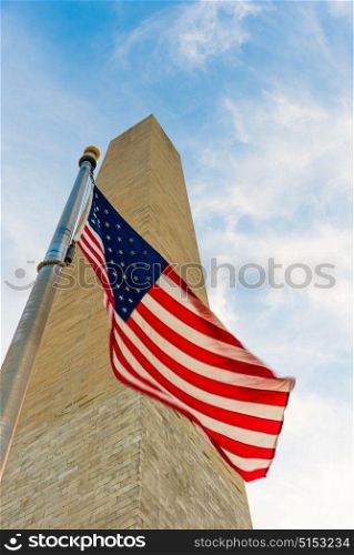 Looking at the Washington Monument from below with the American Flag featured infront