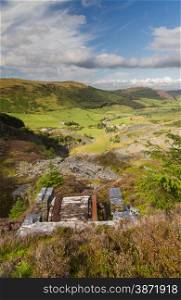 Looking down the welsh valley of Cwm Penmachno, derelict incline drum house disused slate quarry in foreground. Snowdonia, Wales, United Kingdom