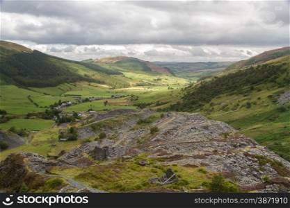 Looking down the welsh valley of Cwm Penmachno, disused slate quarry in foreground. Snowdonia, Wales, United Kingdom